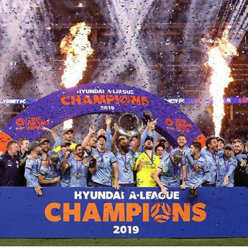 Josh Brillante celebrating an A-League championship with his team