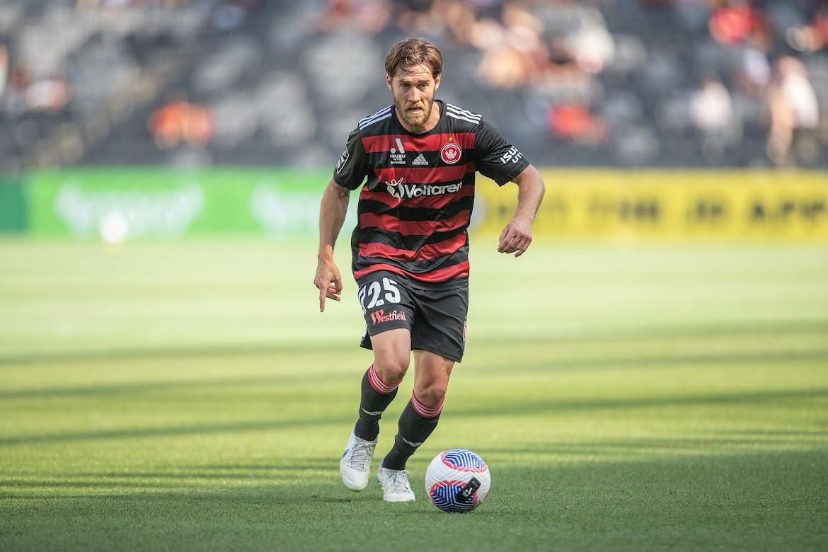 Josh Brillante driving forward with the ball